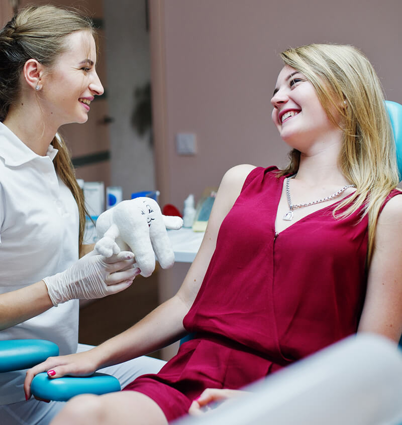 Dentist reviewing 3D aligner plan on screen